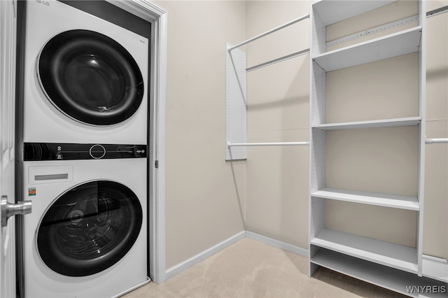 185 York St Unit 1, Buffalo, NY 14213 - laundry room with estacked washer and dryer, carpet flooring, and baseboards