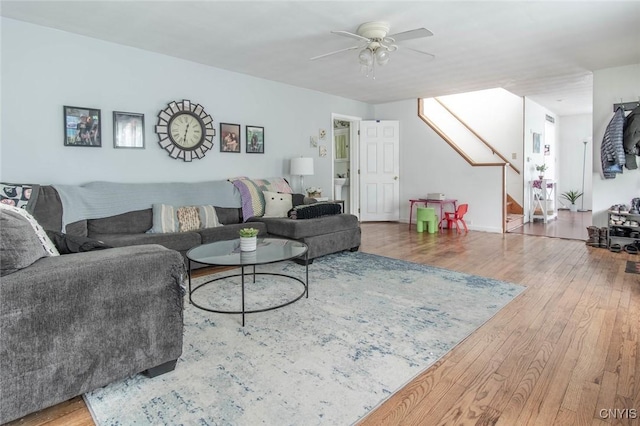 71 Champion St, Champion, NY 13619 - living area with wood finished floors, ceiling fan, and stairway