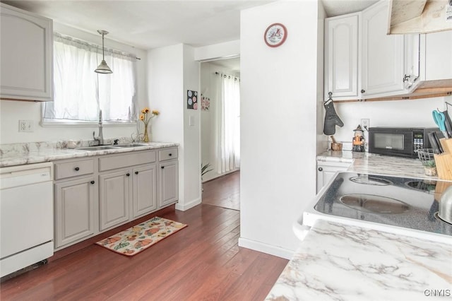 71 Champion St, Champion, NY 13619 - kitchen featuring white dishwasher, wall chimney range hood, black microwave, a sink, and plenty of natural light