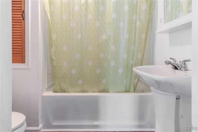 71 Champion St, Champion, NY 13619 - bathroom featuring toilet, a sink, and shower / tub combo with curtain