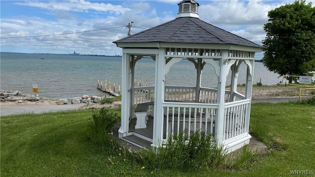 view of home's community with a gazebo, a lawn, and a water view