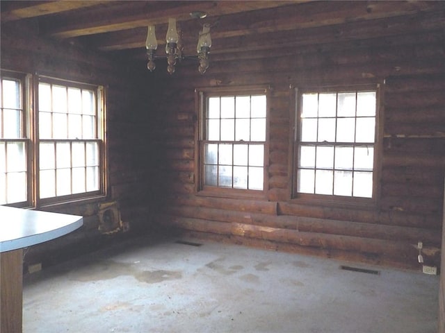 6900 White Rd, Conesus, NY 14435 - unfurnished dining area with rustic walls, a chandelier, and beam ceiling