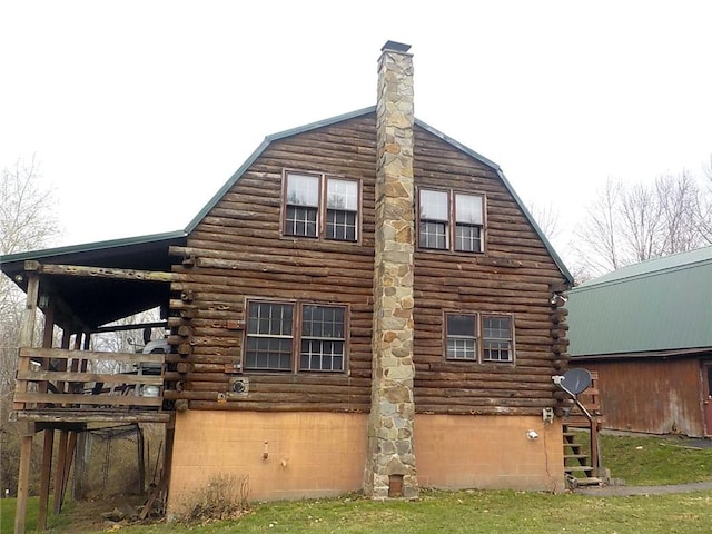 6900 White Rd, Conesus, NY 14435 - view of home's exterior with log siding, a gambrel roof, and a chimney
