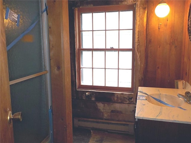 6900 White Rd, Conesus, NY 14435 - bathroom with a baseboard radiator, radiator heating unit, plenty of natural light, and vanity