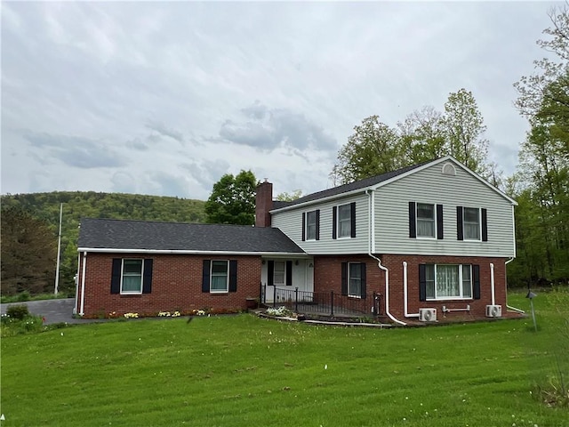 8584 Vieley Rd, Campbell, NY 14821 - view of front of house featuring brick siding, a chimney, and a front yard