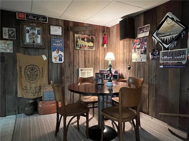 8584 Vieley Rd, Campbell, NY 14821 - dining area featuring wooden walls and a drop ceiling