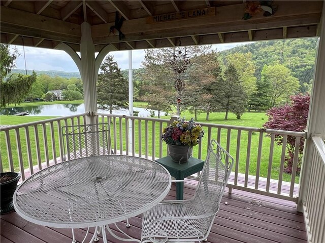 8584 Vieley Rd, Campbell, NY 14821 - deck with a water view, a lawn, and view of wooded area