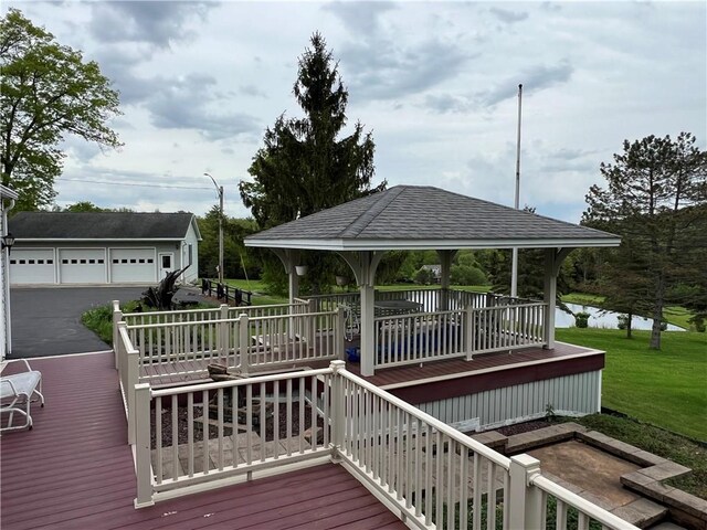 8584 Vieley Rd, Campbell, NY 14821 - wooden deck with a gazebo, an outdoor structure, a water view, a lawn, and a garage