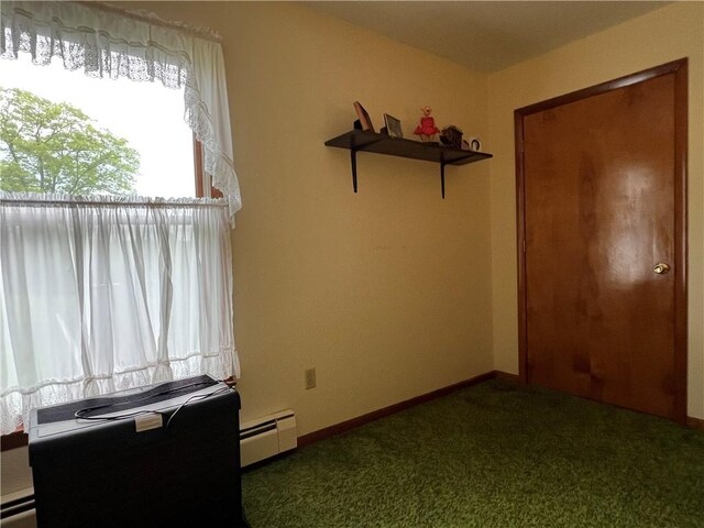 8584 Vieley Rd, Campbell, NY 14821 - unfurnished bedroom with a baseboard heating unit, carpet, and baseboards