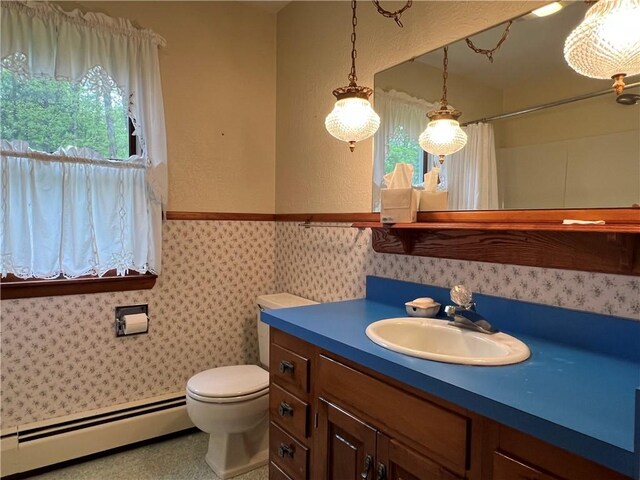 8584 Vieley Rd, Campbell, NY 14821 - full bathroom with a baseboard radiator, healthy amount of natural light, toilet, curtained shower, and a wainscoted wall