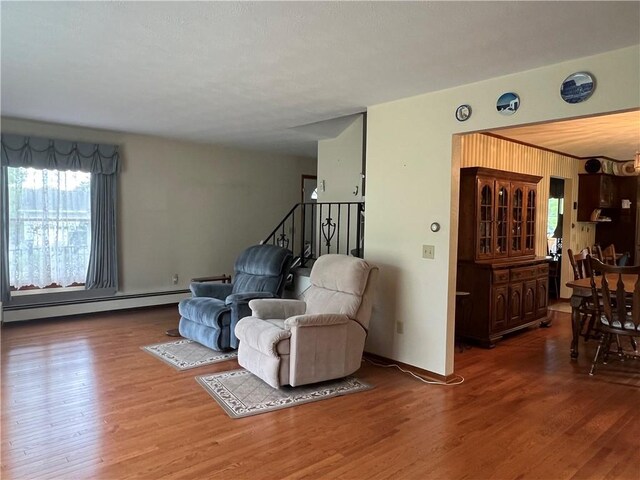 8584 Vieley Rd, Campbell, NY 14821 - sitting room with a baseboard heating unit and wood finished floors