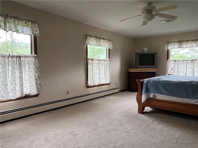 8584 Vieley Rd, Campbell, NY 14821 - bedroom featuring baseboard heating, light carpet, and a ceiling fan