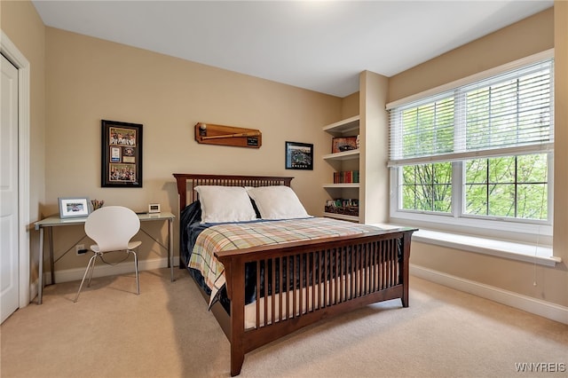bedroom featuring baseboards and carpet flooring