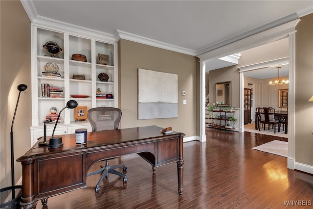 home office featuring a chandelier, wood finished floors, baseboards, crown molding, and built in features