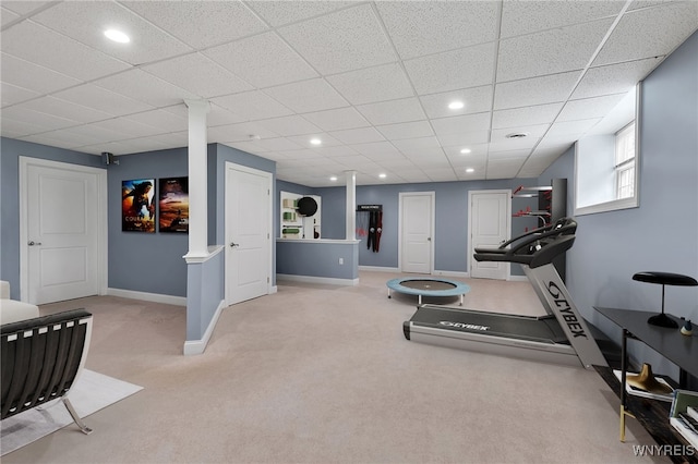 exercise area with carpet flooring, baseboards, a paneled ceiling, and recessed lighting