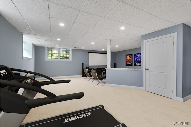 workout room with baseboards, carpet flooring, recessed lighting, and a paneled ceiling