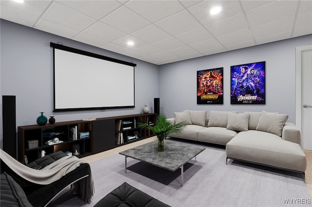 cinema room with a drop ceiling, carpet, and recessed lighting
