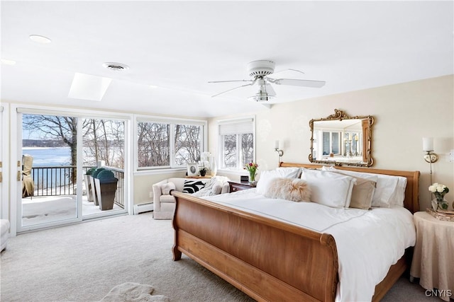 5598 Buck Point Rd, Fleming, NY 13021 - bedroom featuring access to outside, multiple windows, carpet, and ceiling fan