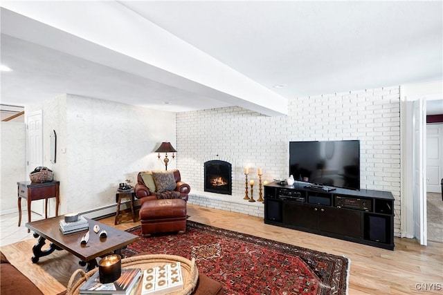 5598 Buck Point Rd, Fleming, NY 13021 - living room with a fireplace, baseboard heating, and wood finished floors