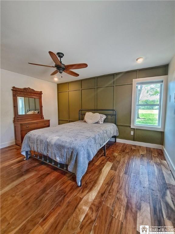 55 Washington Ave, Pomfret, NY 14063 - bedroom featuring wood-type flooring, baseboards, and a ceiling fan