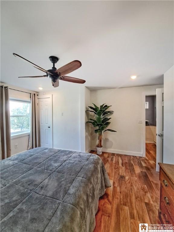 55 Washington Ave, Pomfret, NY 14063 - bedroom featuring wood finished floors, recessed lighting, baseboards, and a ceiling fan