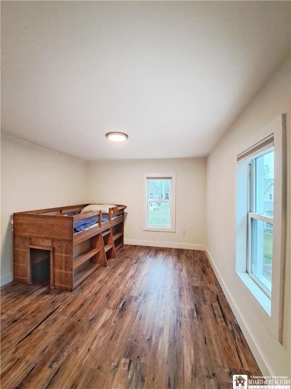 55 Washington Ave, Pomfret, NY 14063 - unfurnished bedroom featuring wood finished floors and baseboards