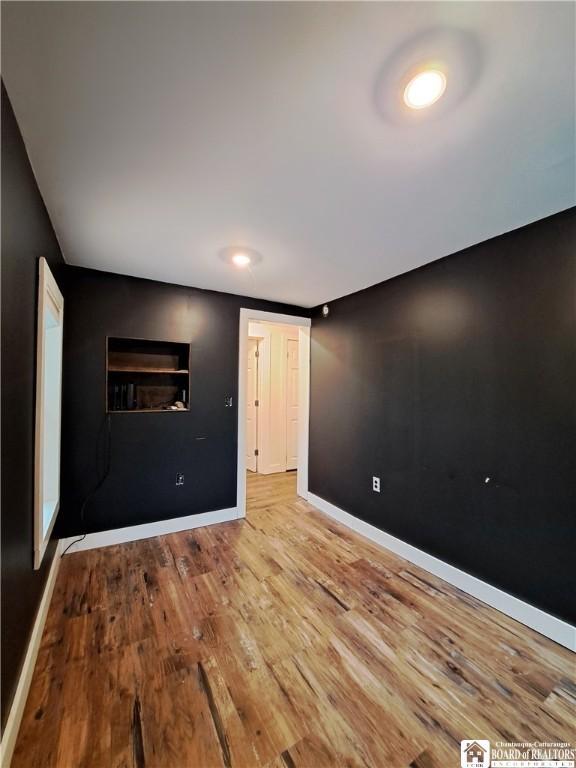 55 Washington Ave, Pomfret, NY 14063 - spare room with baseboards and wood finished floors