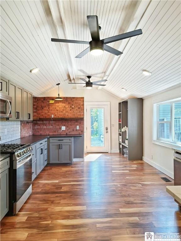 55 Washington Ave, Pomfret, NY 14063 - kitchen with stainless steel appliances, dark countertops, gray cabinetry, a ceiling fan, and baseboards