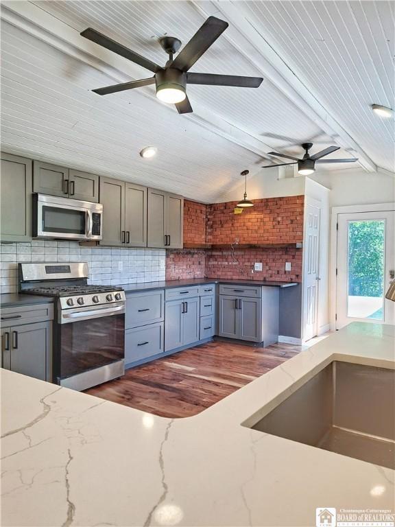 55 Washington Ave, Pomfret, NY 14063 - kitchen featuring appliances with stainless steel finishes, ceiling fan, gray cabinetry, backsplash, and wood ceiling