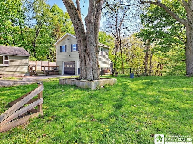 55 Washington Ave, Pomfret, NY 14063 - view of yard with an attached garage and driveway