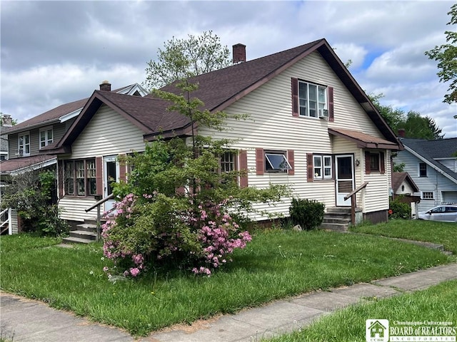 417 Charles St, Jamestown, NY 14701 - bungalow-style house with entry steps, a chimney, a front lawn, and roof with shingles