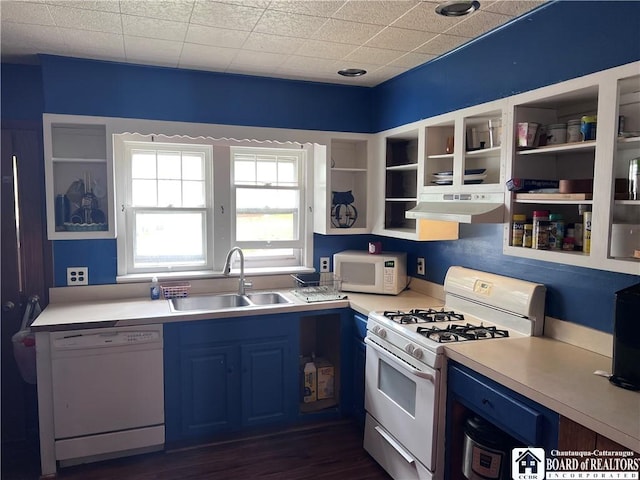 417 Charles St, Jamestown, NY 14701 - kitchen with white appliances, blue cabinets, under cabinet range hood, a sink, and light countertops