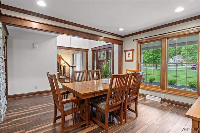 60 Kettle Run, Elma, NY 14052 - dining space featuring dark wood-type flooring, crown molding, stairway, and recessed lighting