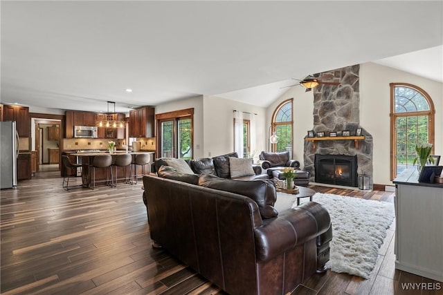 60 Kettle Run, Elma, NY 14052 - living area with lofted ceiling, healthy amount of natural light, a fireplace, dark wood-style floors, and a ceiling fan