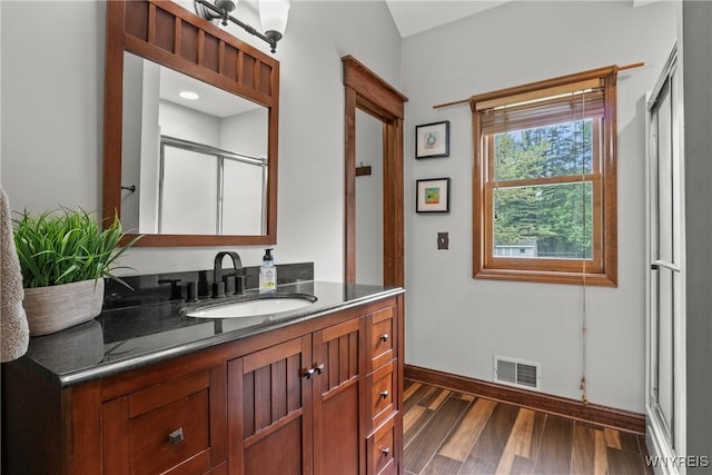 60 Kettle Run, Elma, NY 14052 - full bathroom with vanity, wood finished floors, and a shower with shower door