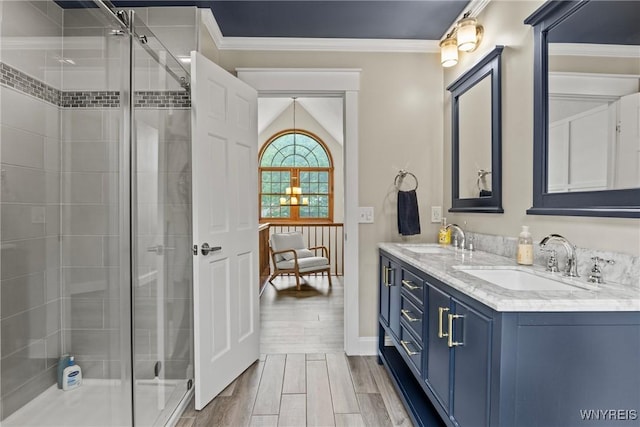 60 Kettle Run, Elma, NY 14052 - bathroom with double vanity, a shower stall, crown molding, and wood finished floors