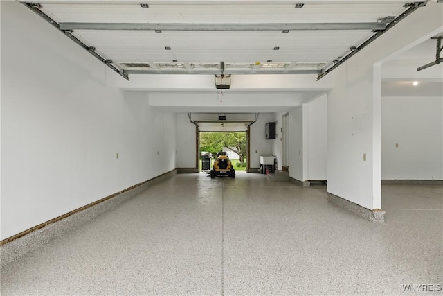 60 Kettle Run, Elma, NY 14052 - garage featuring a garage door opener and baseboards