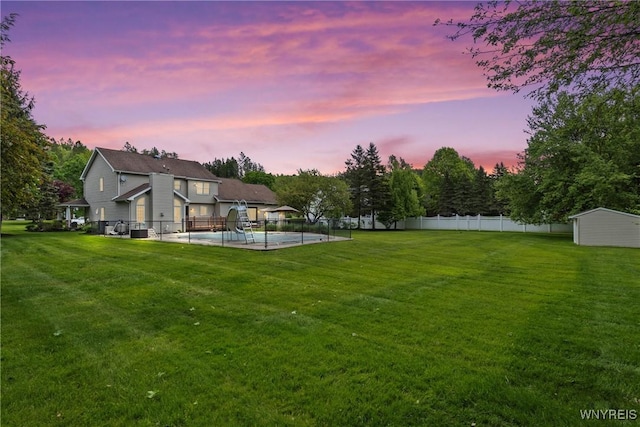 60 Kettle Run, Elma, NY 14052 - yard at dusk featuring a patio, an outbuilding, and view of scattered trees