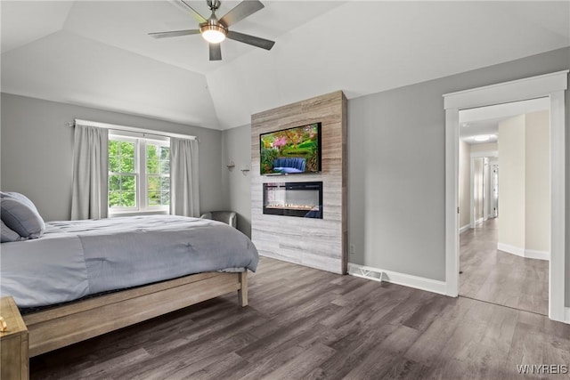60 Kettle Run, Elma, NY 14052 - bedroom with wood finished floors, lofted ceiling, a large fireplace, and a ceiling fan