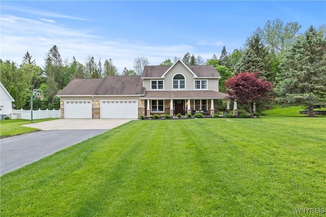 60 Kettle Run, Elma, NY 14052 - colonial house featuring a porch, driveway, and a garage