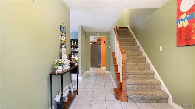 223 Patrice Ter, Amherst, NY 14221 - staircase featuring tile patterned floors and baseboards