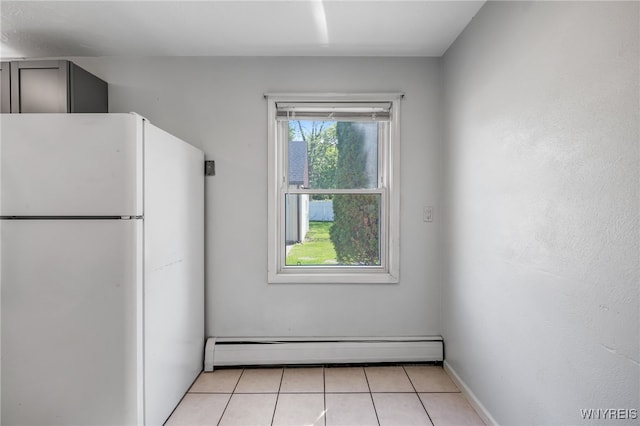 4233 Crescent Dr, Niagara Falls, NY 14305 - kitchen featuring freestanding refrigerator, a baseboard heating unit, light tile patterned flooring, baseboards, and gray cabinets