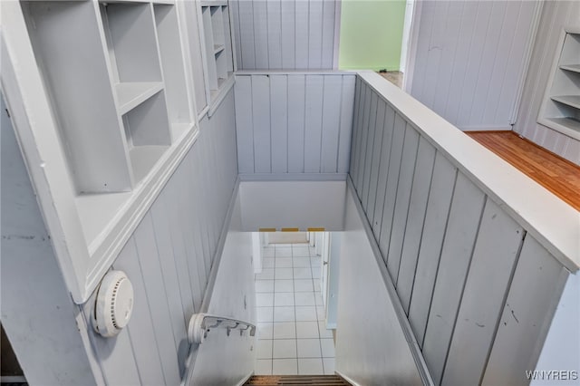4233 Crescent Dr, Niagara Falls, NY 14305 - stairs with wooden walls and tile patterned floors