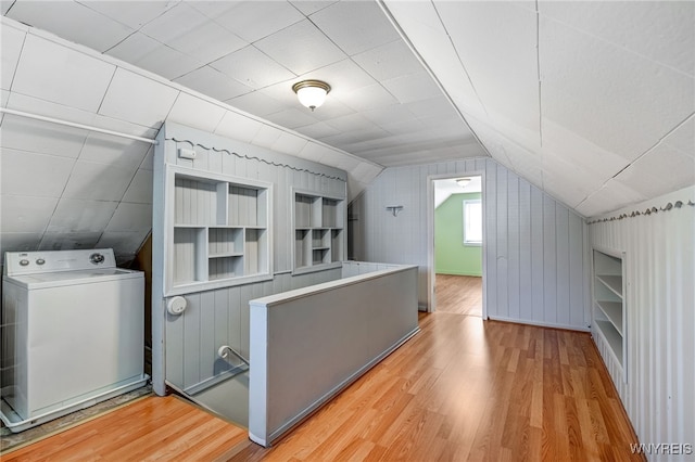 4233 Crescent Dr, Niagara Falls, NY 14305 - additional living space with washer / clothes dryer, wood finished floors, vaulted ceiling, and built in shelves