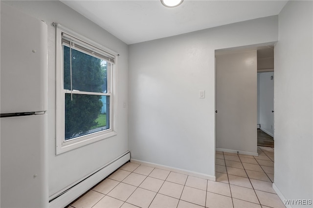 4233 Crescent Dr, Niagara Falls, NY 14305 - unfurnished room featuring a baseboard radiator, light tile patterned flooring, and baseboards