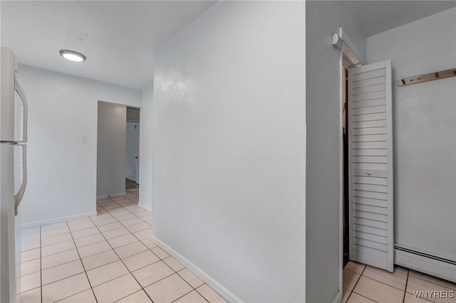 4233 Crescent Dr, Niagara Falls, NY 14305 - corridor featuring a baseboard heating unit, light tile patterned floors, and baseboards