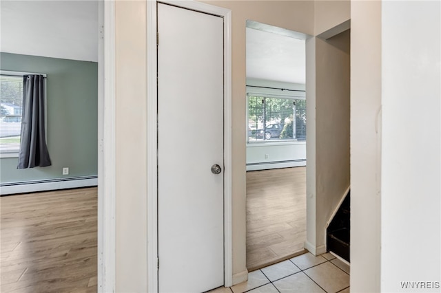 4233 Crescent Dr, Niagara Falls, NY 14305 - hall featuring baseboard heating, light wood-style flooring, and baseboards