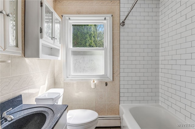 4233 Crescent Dr, Niagara Falls, NY 14305 - full bathroom featuring a baseboard heating unit, tile walls, toilet, bathtub / shower combination, and vanity