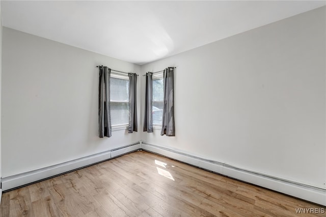 4233 Crescent Dr, Niagara Falls, NY 14305 - unfurnished room featuring wood finished floors and a baseboard radiator