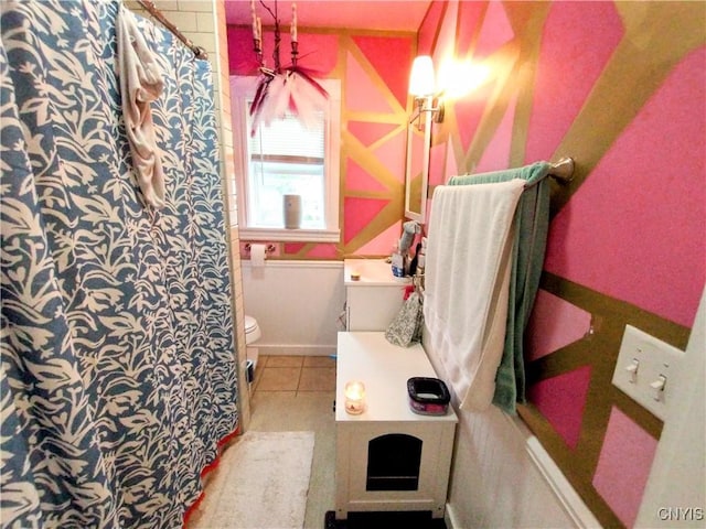 bathroom featuring toilet, tile patterned floors, a shower with shower curtain, and vanity